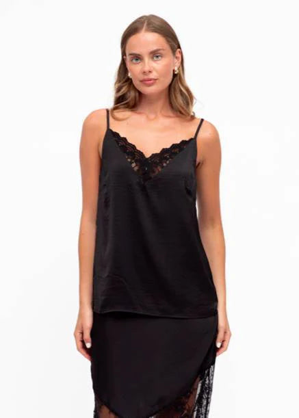 Unleash your bold side with our fierce Liberty Lace Trim Cami in black! This stunning top features a silky soft fabric, delicate lace trim, and adjustable straps. It's fully lined for ultimate comfort and style. Lace up your look today!