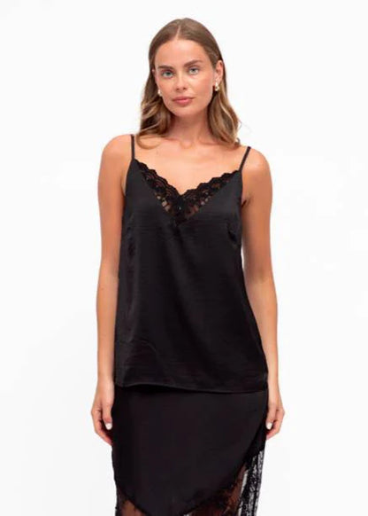 Unleash your bold side with our fierce Liberty Lace Trim Cami in black! This stunning top features a silky soft fabric, delicate lace trim, and adjustable straps. It's fully lined for ultimate comfort and style. Lace up your look today!