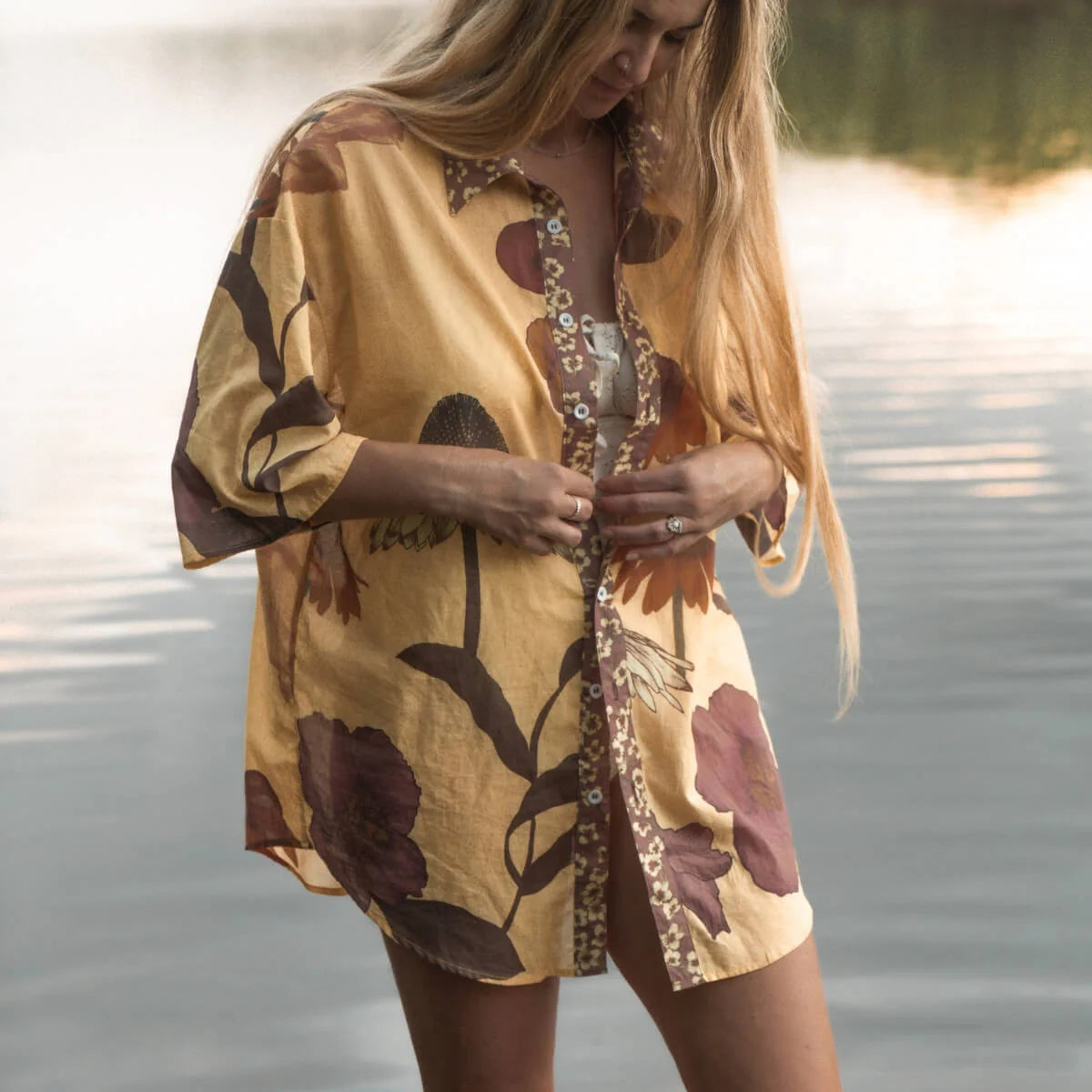 Our Glades Chamomile over swim Shirt is made from an organic cotton voile, a semi sheer fabric with all over large floral print featuring a contrast placket in the Petite Butter ditsy print, finished with coconut buttons up the front. It's a One size over swim shirt, that fits a size 6-8 to a size 16 with a different look on each size.