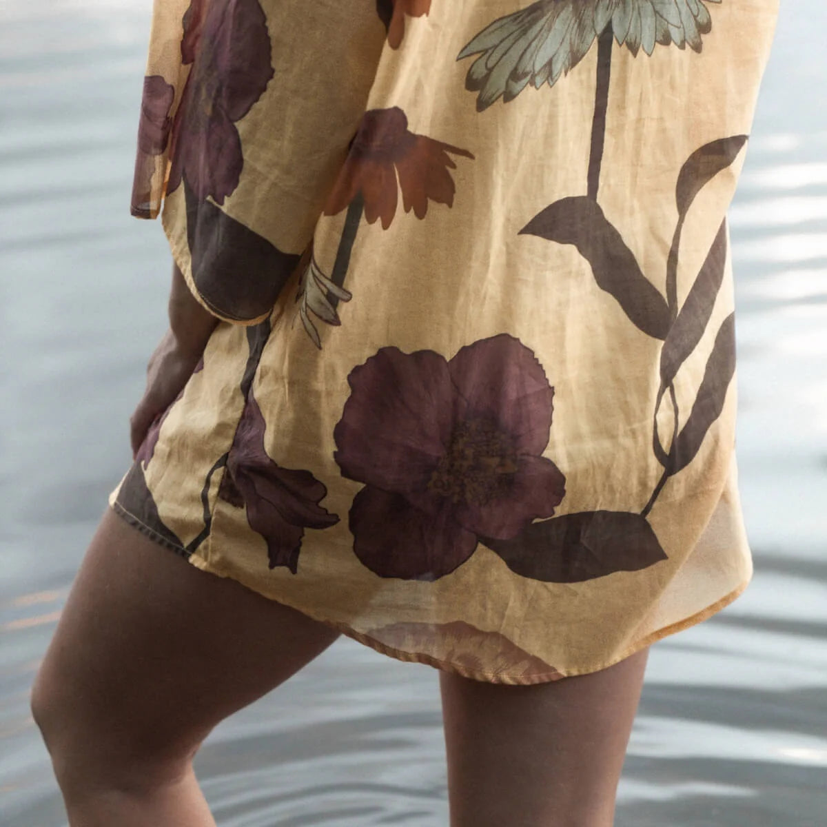 Our Glades Chamomile over swim Shirt is made from an organic cotton voile, a semi sheer fabric with all over large floral print featuring a contrast placket in the Petite Butter ditsy print, finished with coconut buttons up the front. It's a One size over swim shirt, that fits a size 6-8 to a size 16 with a different look on each size.