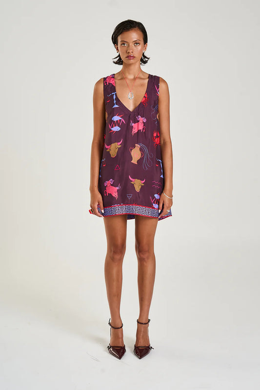 The V-Neck Shift dress featuring the Zodiac print with SS trim presents a relaxed fit that ends at a flattering mini length. Made from a smooth, silky cupro blend, it boast front pockets and can be styled alone or layered with a shirt underneath for an elevated look.