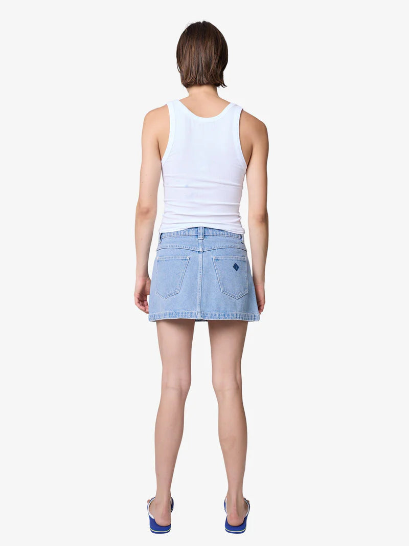 Channel effortless ’90s energy with the 95 A-Line Skirt - Jordan — your new denim essential designed for everyday cool.

Crafted from soft yet structured mid-wash blue denim, this mini skirt features a classic A-line silhouette that flatters every shape. With a mid-rise fit, raw hemline, and just the right amount of vintage edge, it’s the perfect balance of nostalgic and modern.