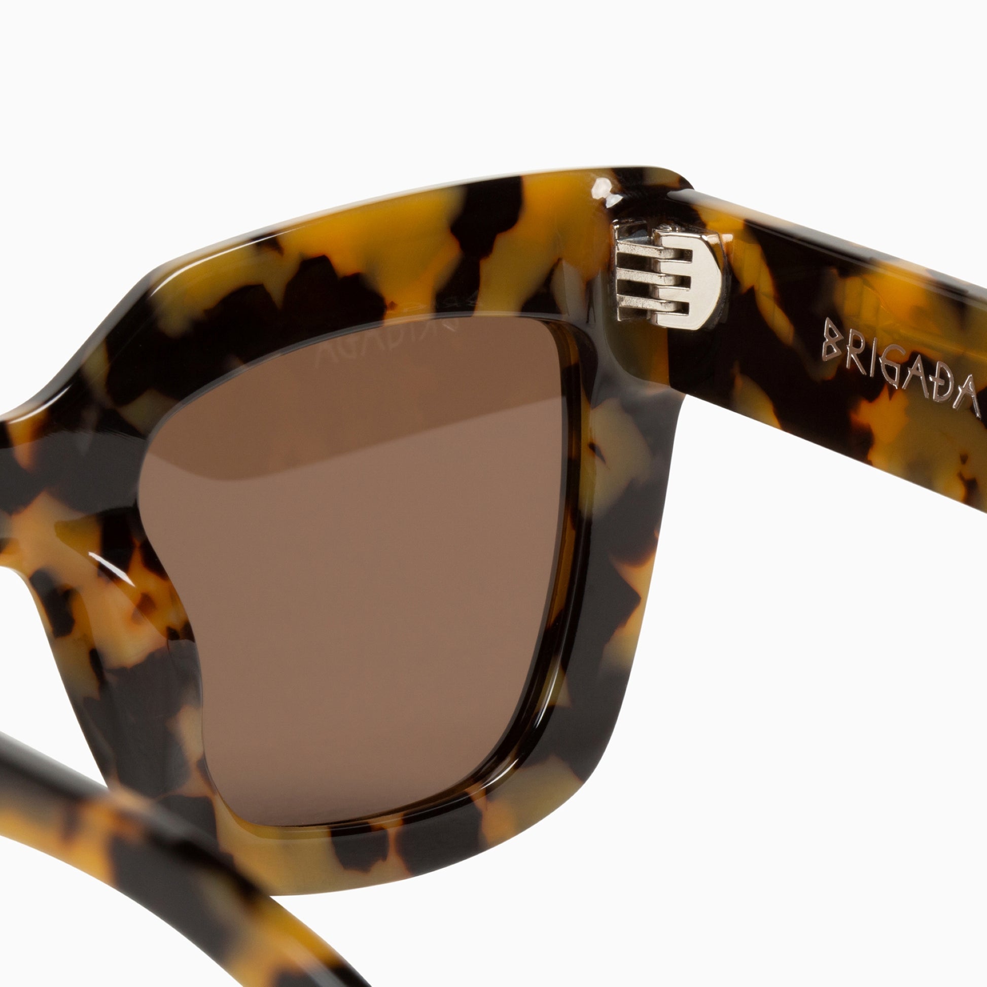 The Lullaby Club Brigada Sunglasses Yellow Tort Close up of lens