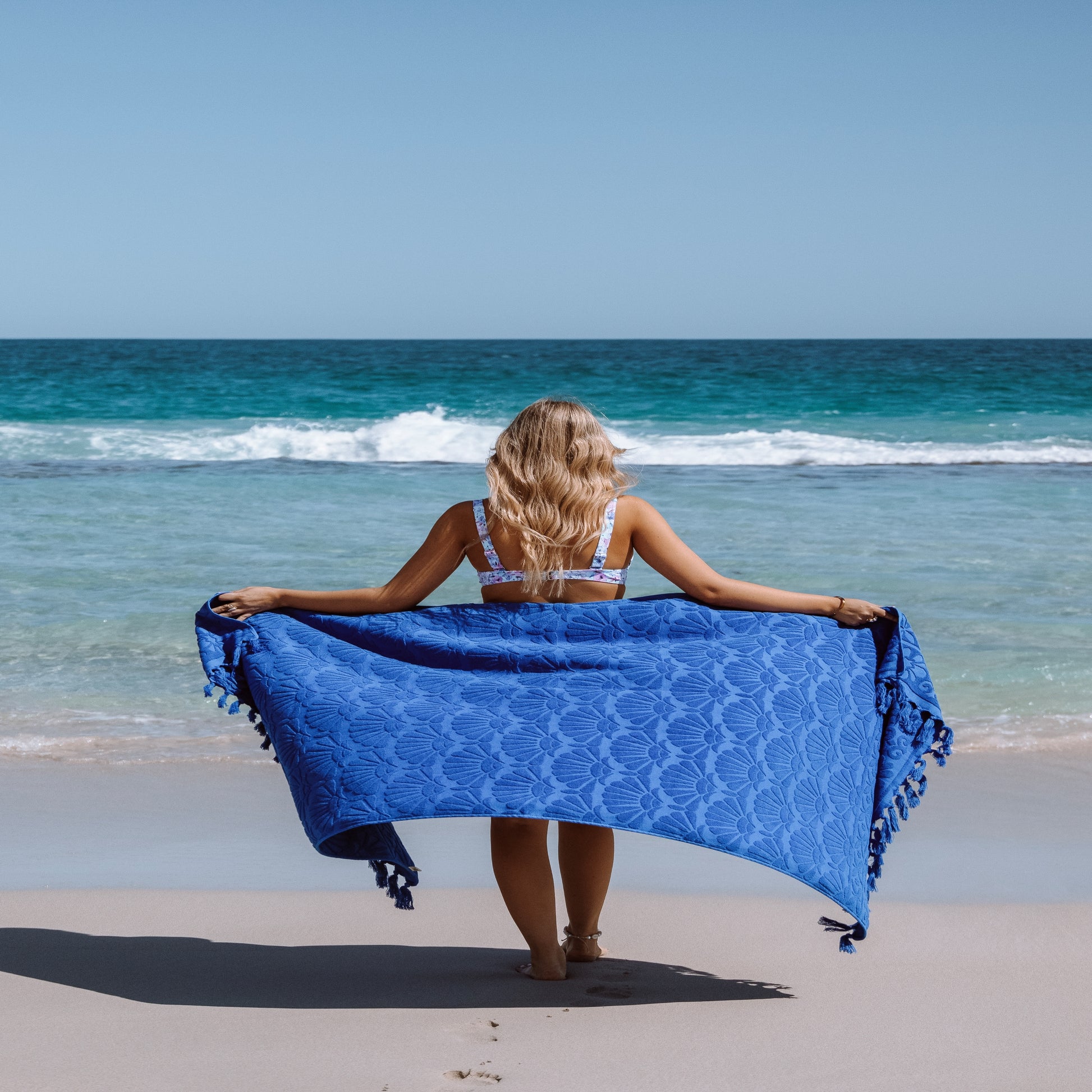 Isla In Bloom Lucia Cobalt Beach Towel Model holding up