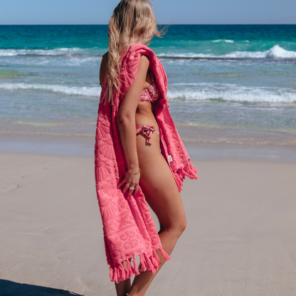 Isla in Bloom Lucia Hot Pink Beach Towel Model Holding over shoulder