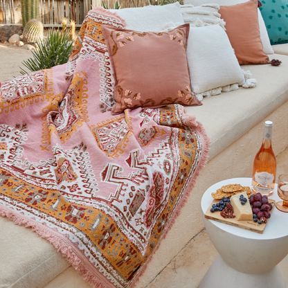 Wandering Folk Pink Sands Wandering Throw Draped on Couch