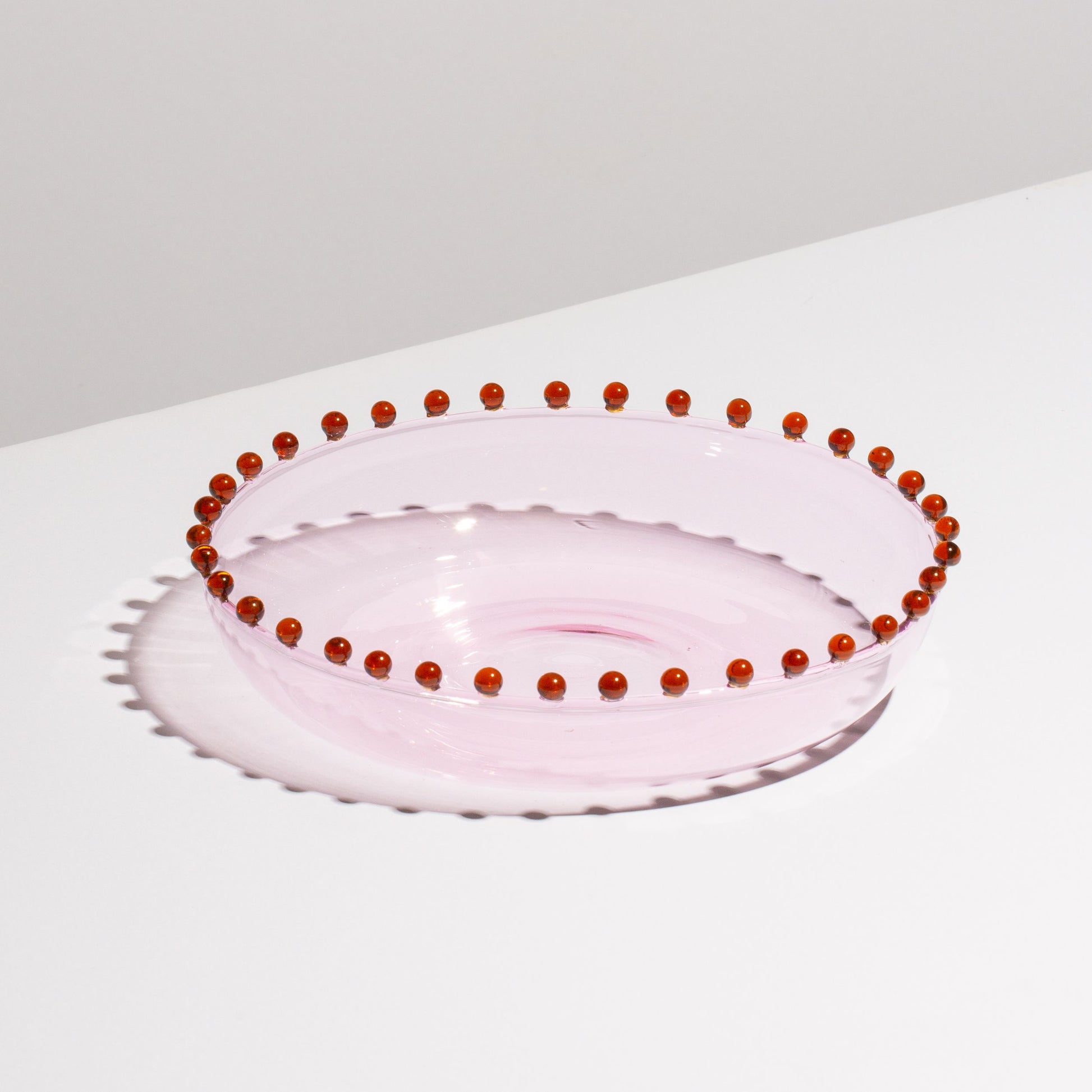 The shape lends itself beautifully to sharing all sweet or savoury dishes. Use the Pearl Platter for healthy summer salads, grilled shellfish with lemon, or apple crumble. This delicate piece is made for grown-ups and the fanciest of soirees.